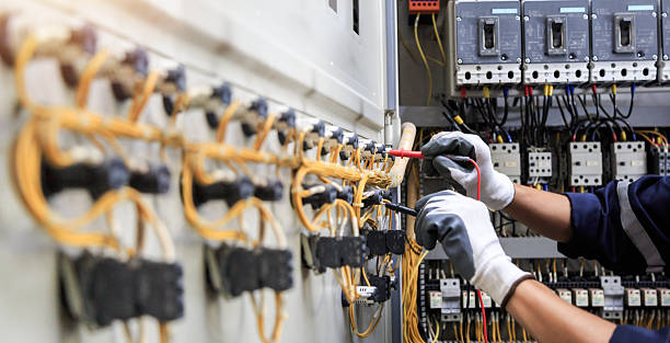 Professional Electrician technician working in Raymore, MO